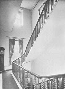 The elegant staircase showing cast iron balusters